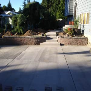 Photos by Rc Healthy Lawns #1 Full yard restoration pavers, retaining walls, vegetable gardens, flower beds, sod, shrugs ,plants and trees.