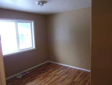 Interior/exterior painting and staining three bedroom house, installing trims, complete repainting (7 colors),