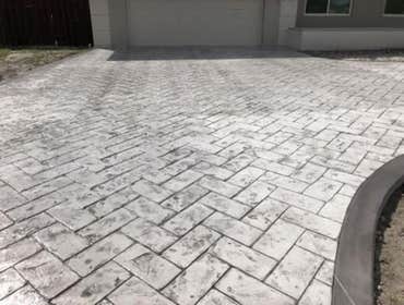 Photos by Stamped Concrete Denver LLC #1 Stamped concrete, often called textured or imprinted concrete, replicates the look of many different stones su