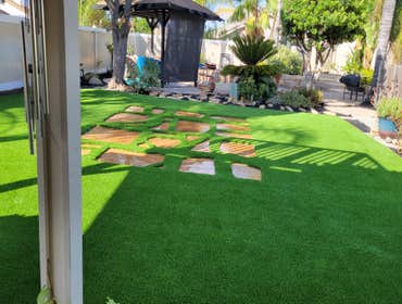 Photos by Jz Synthetic Products #3 Flagstone, with beautiful turf all around..
A great flagstone install with some high quality turf to add to its beau