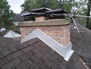Re build Chimney Tear off old Chimney, and rebuild plus seal brick with new flashing
