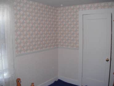 Stone House Remove cabinets and window, add wall closet to bedroom, install sliding door, tile on inside of slider, add secound story deck to front of 