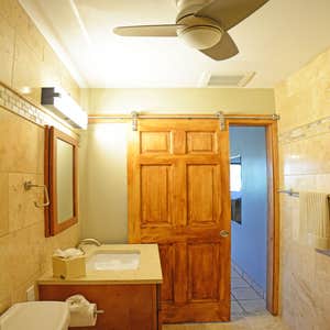 Waiohuli Beach Hale In just 22 days we completely gutted and replaced an entire bathroom. There is wall to wall tile and a barn style door. The...