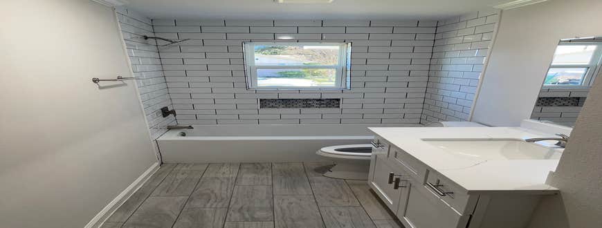 Bathroom Renovation Went down to the studs and rebuilt 2.5 baths. All plumbing, tile, sheetrock, electrical, flooring and hvac work was completed ...