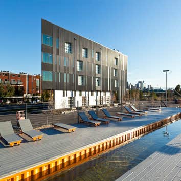 Shipping Container Swimming Pool Above grade pool fabricated out of two 40' containers with roofs removed. Surrounding deck structure out of repurpose