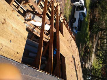 Photos by Service Restoration Pros LLC #1 A tree fell through the roof of this 3 bedroom house during Hurricane Ida. It left several gaping holes and a