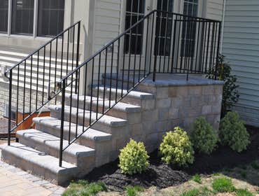 Patio and fence in Laurel, MD We created a great outdoor family space with a patio, sitting wall, landing are and fencing.