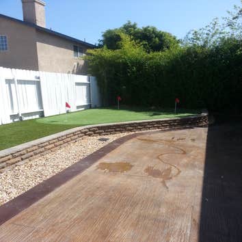 Gainford Backyard remodel Complete tare out and renovate entire backyard with grading stone retaining wall and fire pit, area drains, electircal for l