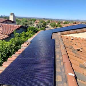 6.8 kW Solar Array on TerraCotta tile roof mounted onto asphalt-shingle base