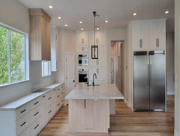 Photos by Cactus Valley Homes LLC #2 home remodel with all of our new cabinetry we installed along with new countertops and plumbing fixtures.