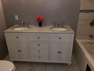 Photos by Gc Drywall #7 Bathroom addition to a basement laundry room.