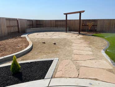 Photos by Cal Valley Landscape #2 Demo and concrete, retaining wall, trellis, dg sand with flagstone