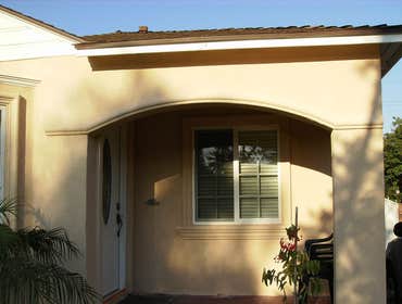 South Gate by A. C. Framing And General Contractor, Inc. Added new windows, changed the front door, closed the front yard porch and added stair steps t