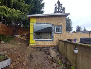 Photos by Stewart & Son Gate & Fence LLC #1 Tiny House with pergola. Small house 17' by 12' small bathroom with pocket door, and small sink with water 