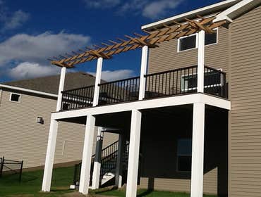 Photos by Custom Home Specialties Inc #2 Timber Tech maintenance free decks with powder coated railings.