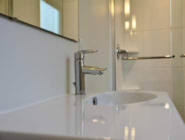 Kitchen, Master, & Hallway Bath Renovation Clean, calm and contemporary were the main goals for the homes renovations. Removal of a partition wall and 
