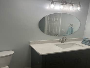 Wide Vanity with Round Mirror