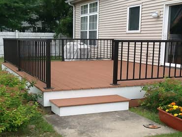 Photos by Custom Home Specialties Inc #2 Timber Tech maintenance free decks with powder coated railings.