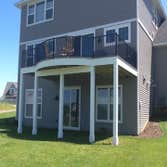 Photos by Custom Home Specialties Inc #2 Timber Tech maintenance free decks with powder coated railings.