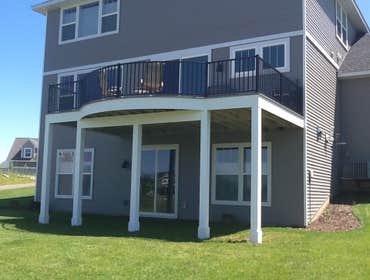 Photos by Custom Home Specialties Inc #2 Timber Tech maintenance free decks with powder coated railings.