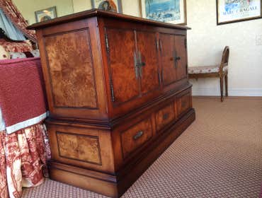 Custom veneered hidden TV cabi