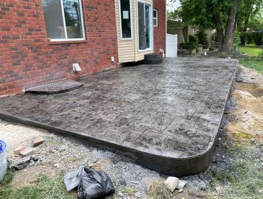 Photos by Guevara Alexander #1 A curated collection of our high-end residential concrete work, including stamped patios, exposed aggregate driveways, w