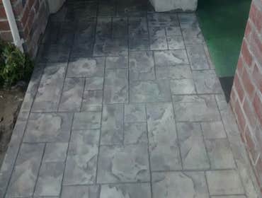 Photos by Colossal Concrete #1 Ashlar Cut Slate Sidewalk and entry, brick wall and Patio restoration via patching and Stain and Seal.