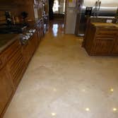 Travertine Clean/Polish/Color Seal This floor was dirty and dull. We decided to attack it with a general cleaning followed by a three step polish and f