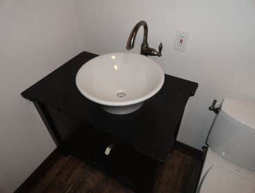 Kitchen and Bathroom Counters Beautiful black Granite countertops with a chiseled edge in the kitchen and bathroom.