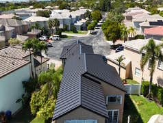 Photos by Gold Star Miami Corp #1 metal roof panels all are . 25 years warrantee