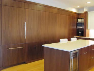 Oylha Olyha residence in Sykesville, MD area, our “Hand Planed” custom line was use which also included Book Match walnut base cabinets and island cabi