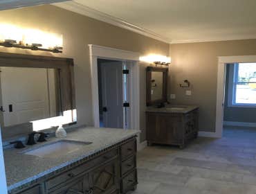 Photos by Thomas Elliott #1 2100 sf home with partially finished pre-cast concrete basement. This home has wood flooring, custom woodwork, tile and cab