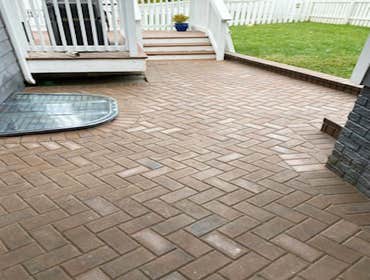 Stylish Backyard patio and walkway with gate Upgraded clients backyard with an inviting patio and walkway, complete with gate.