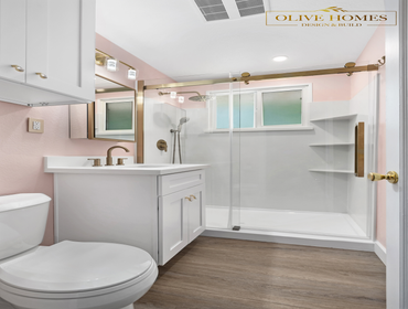 Chic Pink Bathroom Remodel with Gold Fixtures in Sacramento, CA 95864 This playful yet sophisticated bathroom remodel proves that bold design can be hi