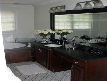 Guest Bath Handicap accessible full bath. originally built in 1950, this completely renovated bath is spacious with 3/4 height floor to ceiling tile,