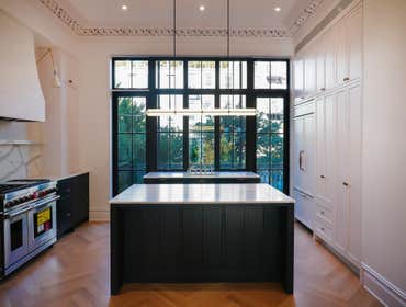 Photos by Demin's Kitchen Atelier #1 This kitchen features solid wood shaker-style fronts finished in smooth, shop-sprayed paint. Deep navy lower cabin