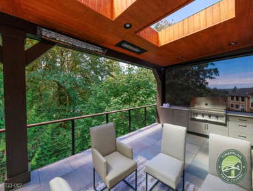 MANUCHARYAN PROJECT This custom outdoor living project combines architectural structure, premium materials, and integrated amenities to create a highly