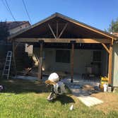 Roofing job, with exterior patio cedar beams.