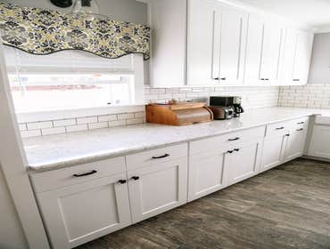 Clowdus Kitchen This client came to me with a vision for a custom kitchen that would make the space feel larger and maximize storage. We designed pull-