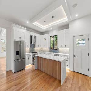 New Home Build in Arlington MA 1×4 fir soffit with modern styled two-tone siding • heated asphalt & cobblestone driveway with snowflake “auto-on”...