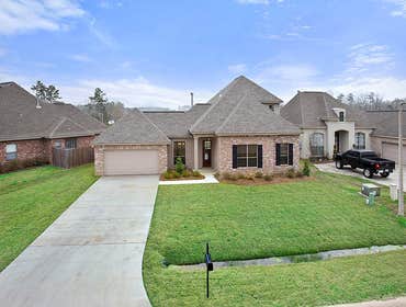 Photo(s) from Jenkins Homes, Inc. This is a 3 bedroom, 2 1/2 bath two story home overlooking a beautiful pond in Madisonville, LA. It features custom c