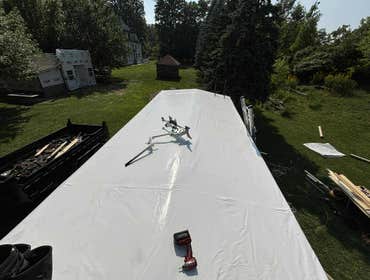 Photos by Ideal Roofing LLC #1 Complete rebuild of an old train caboose that had a rotten roofing frame and deck.