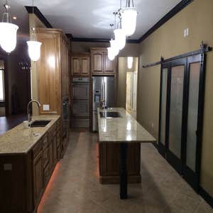 Okc Remodel Beautiful kitchen remodel with custom Barn door on pantry. bathroom remodel in edmond
