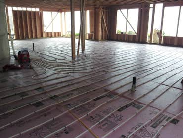 Photo(s) from Radiant Floor Heating Specialist Commercial boiler room with Lochinvar boilers and piping, Trucking companies Clean Burn waste oil burnin