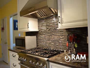 Barnsley Kitchen The Barnsley Kitchen remodel is one of our finest yet. The corian countertops, mosaic tile backsplash, brown high top table and nickel