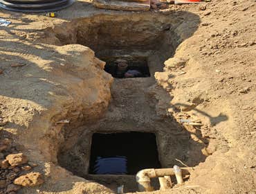 Photos by Bdp Services, Inc #1 Locate septic tank, expose lids to have the tank pumped. After pumping it was discovered that the septic divider wall ne