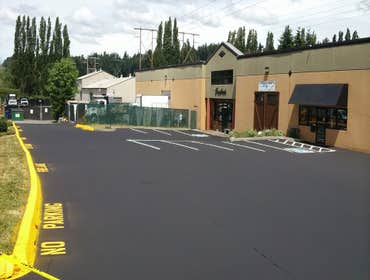 Scrivanich Natural Stone Parking Lot Sealcoat/Stripe