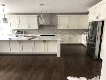 Single Family Home Renovation - West Loop, Chicago Renovated a townhome in the West Loop area with a new kitchen, flooring, custom staircase, new light