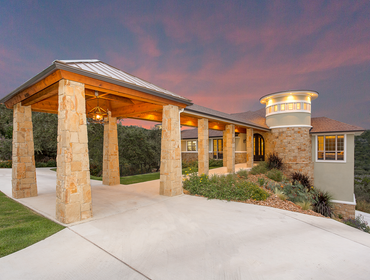 Panther Valley - Custom Home The design of the home incorporates a covered portico and tower as signature elements that you see when approaching the ho