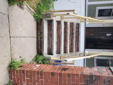 Photos by Triple Infinity LLC #1 The brick stairs were not original to the home and needed some replacing, since they did not match the new deck that w